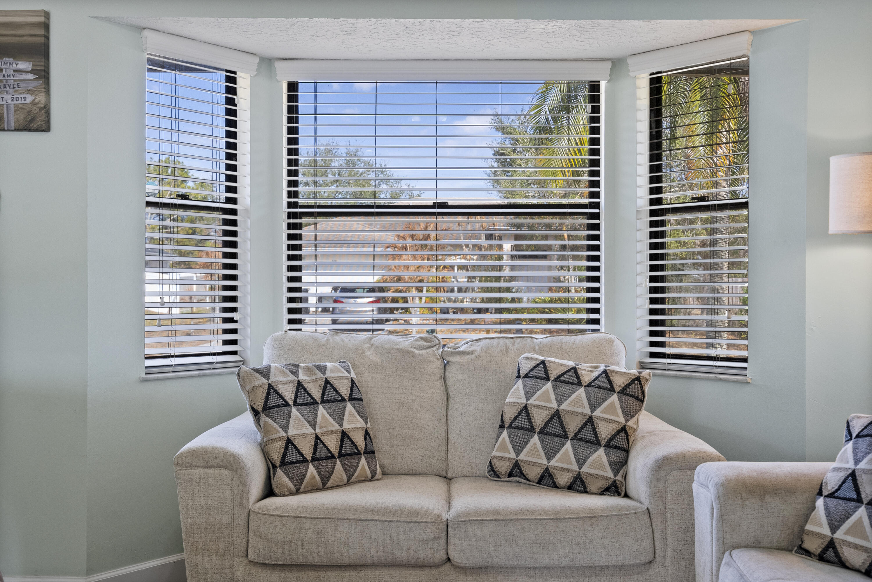 822 Southwest Harvard Road Port St. Lucie, FL 34953 - Photo 8 of 43 a living room with furniture and a large window