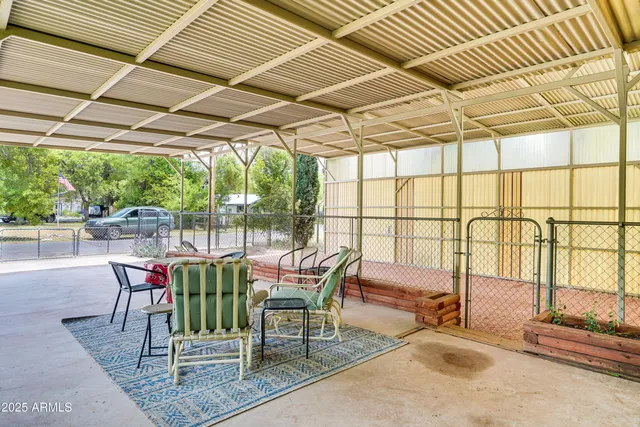 a balcony with furniture and garden view