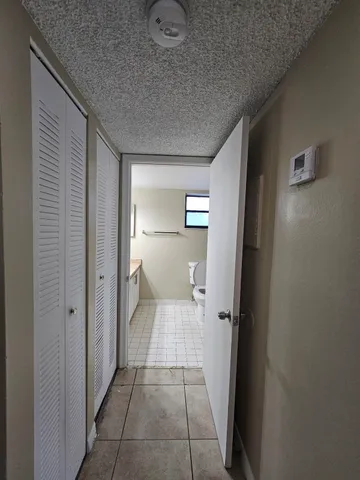 a bathroom with a sink vanity granite and a mirror