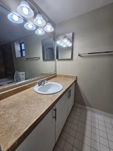 a bathroom with a bathtub and toilet