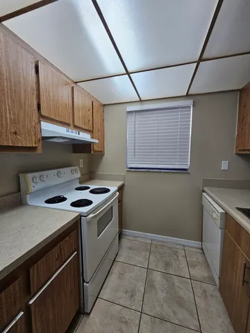 a kitchen with a stove and a cabinets