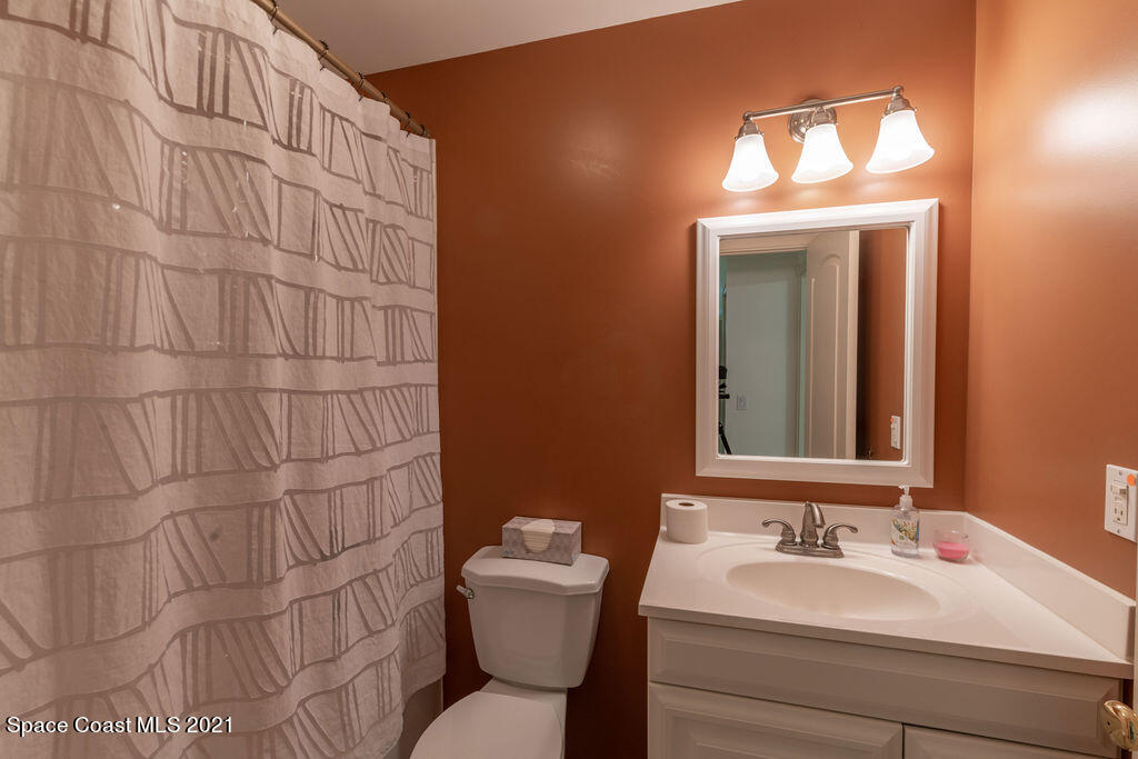 1063 Whitehurst Road Southwest Palm Bay, FL 32908 - Photo 11 of 20 a bathroom with a sink and a toilet