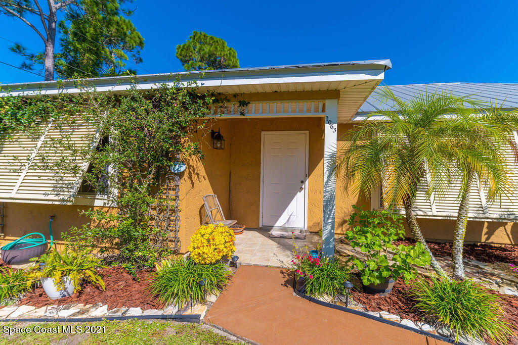1063 Whitehurst Road Southwest Palm Bay, FL 32908 - Photo 4 of 20 a view of a entryway door of the house