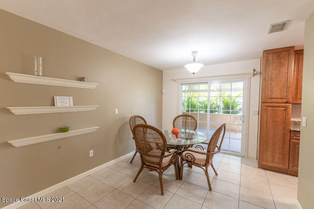 1063 Whitehurst Road Southwest Palm Bay, FL 32908 - Photo 7 of 20 a view of a dining room with furniture and a window