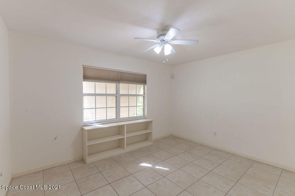 1063 Whitehurst Road Southwest Palm Bay, FL 32908 - Photo 10 of 20 a view of an empty room with a window