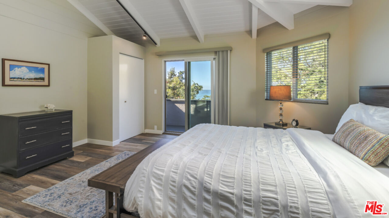 191 Rincon Point Road Carpinteria, CA 93013 - Photo 12 of 19 a bedroom with a bed and a window