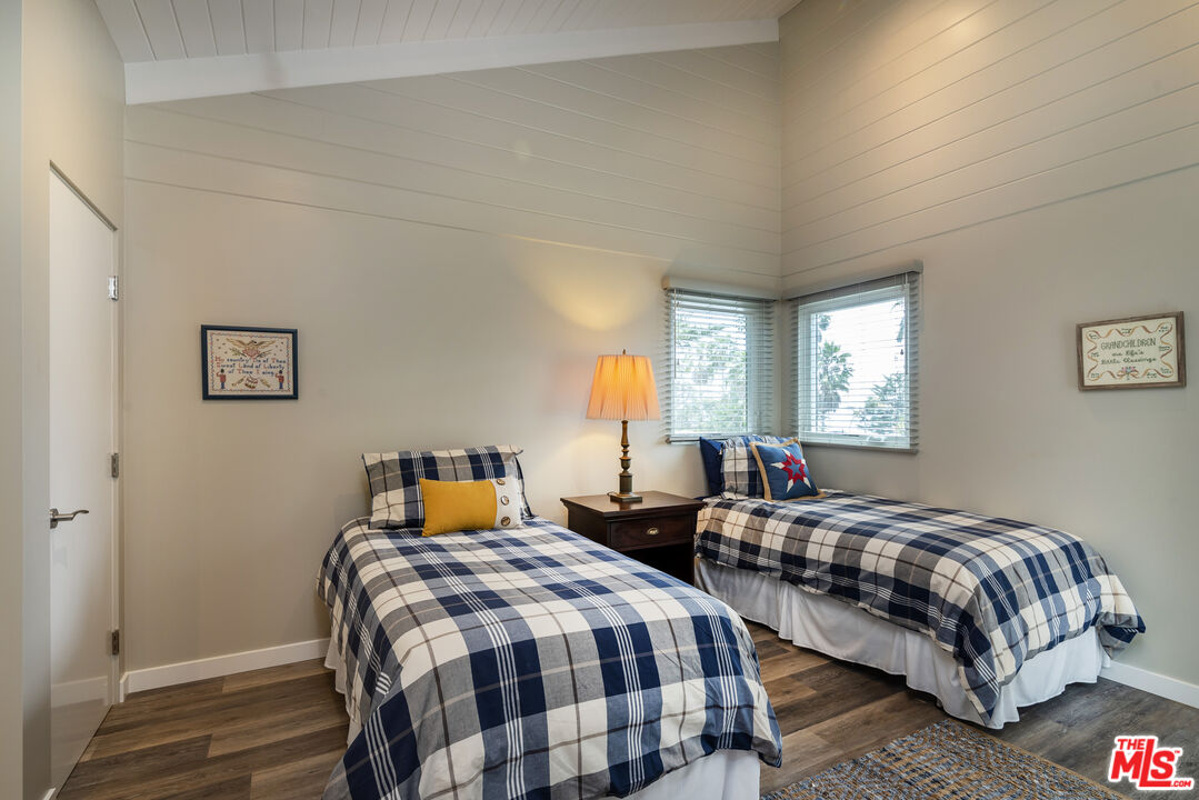 191 Rincon Point Road Carpinteria, CA 93013 - Photo 15 of 19 a bedroom with two beds and a window