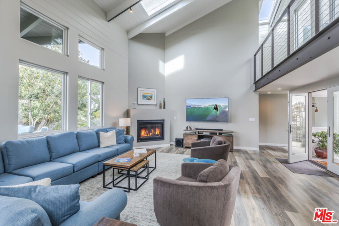 191 Rincon Point Road Carpinteria, CA 93013 - Photo 5 of 19 a living room with furniture and a fireplace