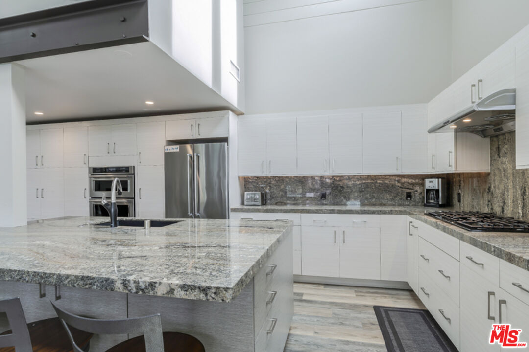 191 Rincon Point Road Carpinteria, CA 93013 - Photo 6 of 19 a kitchen with stainless steel appliances granite countertop a sink and stove