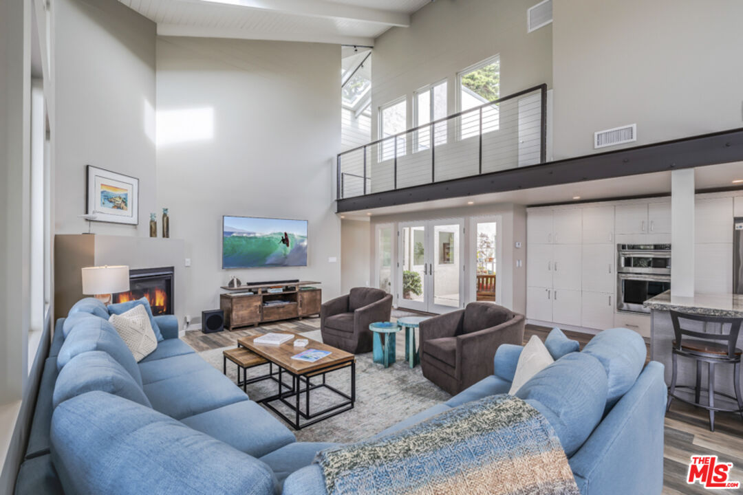 191 Rincon Point Road Carpinteria, CA 93013 - Photo 8 of 19 a living room with furniture ceiling fan and a window