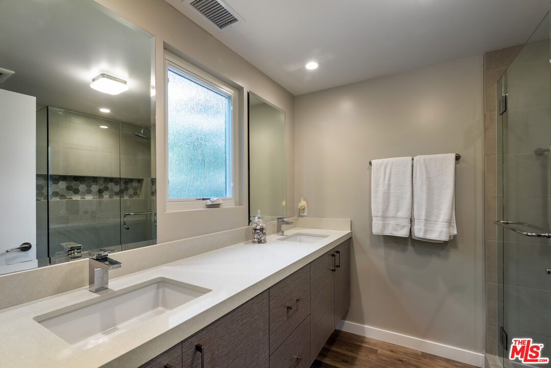 191 Rincon Point Road Carpinteria, CA 93013 - Photo 9 of 19 a bathroom with a sink double vanity and a mirror