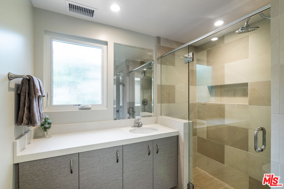 191 Rincon Point Road Carpinteria, CA 93013 - Photo 10 of 19 a bathroom with a double vanity sink mirror and shower
