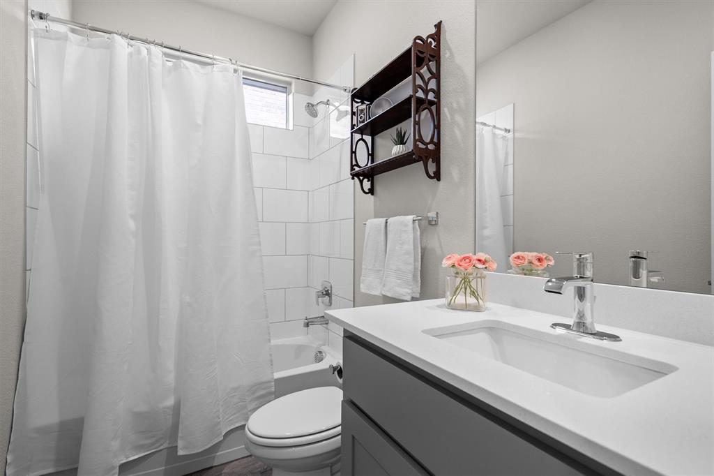 1864 Mensa Drive Haslet, TX 76052 - Photo 30 of 40 a bathroom with a sink toilet and shower