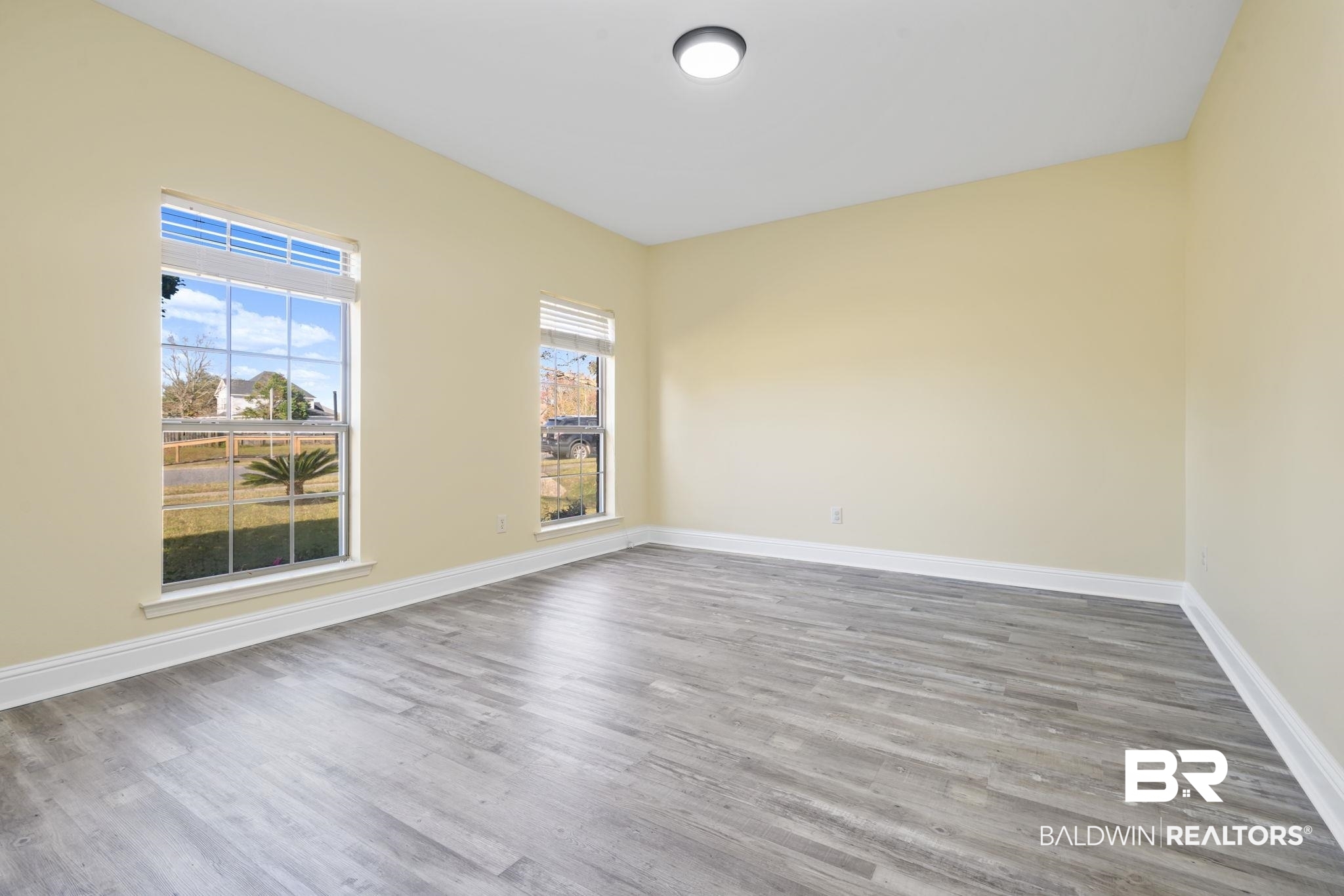 25234 Fairfax Road Daphne, AL 36526 - Photo 13 of 45 Empty room with wood finished floors