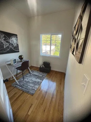 a living room with couch and a window
