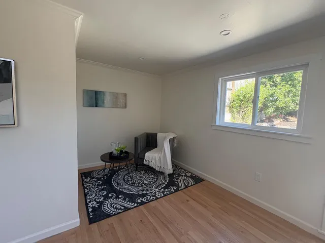 a room with a bed and a window