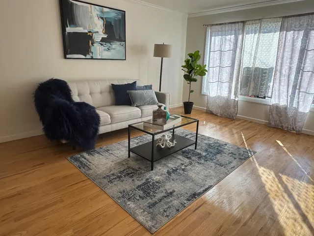 a living room with furniture and a rug