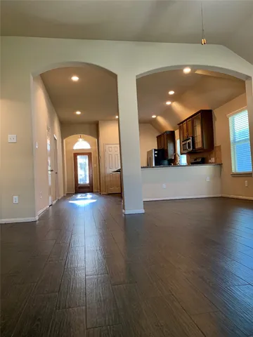a kitchen with granite countertop a sink and a stove