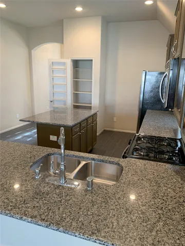 a view of an empty room with a closet