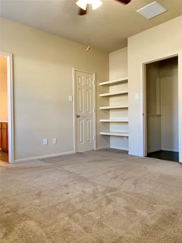 a bathroom with a toilet a sink and a window
