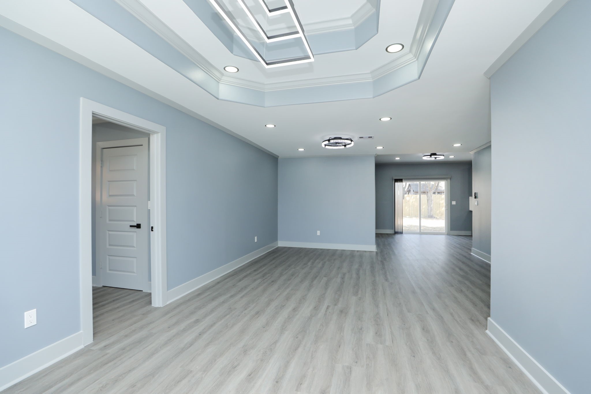 4047 Juliet Street Houston, TX 77087 - Photo 5 of 38 an empty room with wooden floor and windows