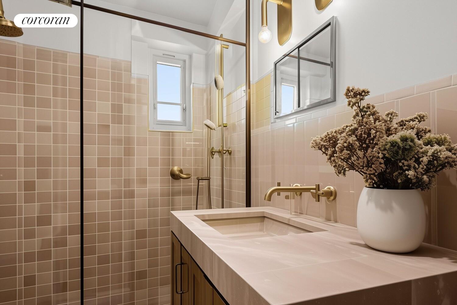 175 Adams Street, Unit 5H Brooklyn, NY 11201 - Photo 11 of 18 a bathroom with a sink a toilet and shower