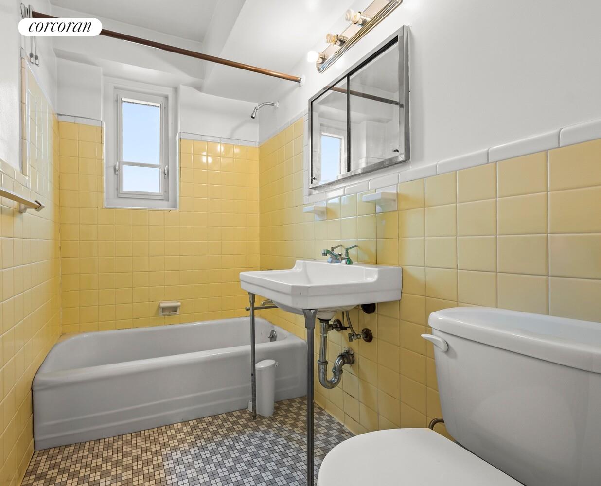 175 Adams Street, Unit 5H Brooklyn, NY 11201 - Photo 12 of 18 a bathroom with a sink a toilet and bathtub
