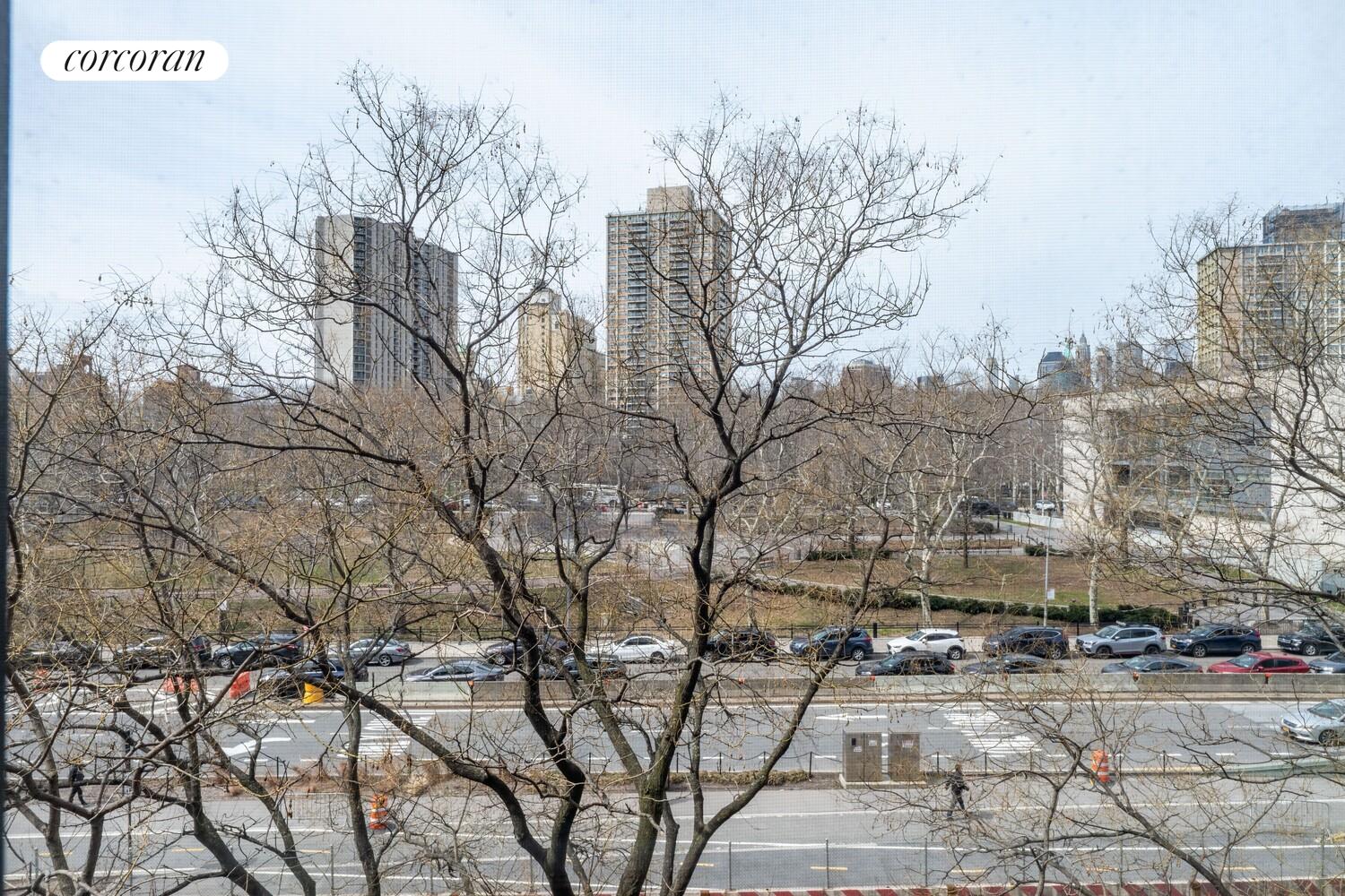 175 Adams Street, Unit 5H Brooklyn, NY 11201 - Photo 17 of 18 a backyard of a house with large trees