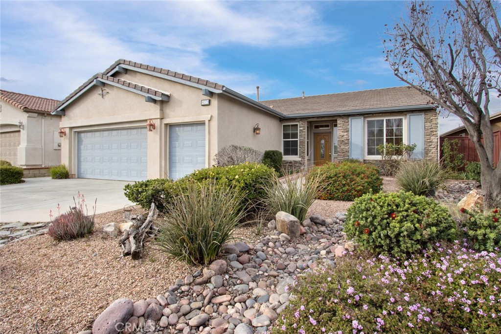 8172 Parry Drive Hemet, CA 92545 - Photo 1 of 47 Rock river bed landscaping for easy maintenance and great curb appeal, two car garage plus golf cart garage!