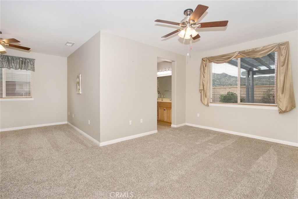 8172 Parry Drive Hemet, CA 92545 - Photo 15 of 41 Main bedroom with a spacious area, maybe a sitting area, gym, possibilities are endless!
