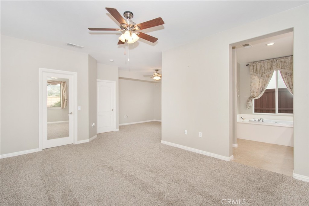 8172 Parry Drive Hemet, CA 92545 - Photo 22 of 47 Main bedroom with view to walk in closet, sitting area, and ensuite bathroom