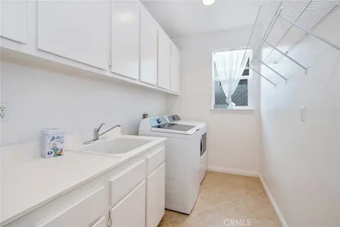 a bathroom with a toilet and a shower curtain