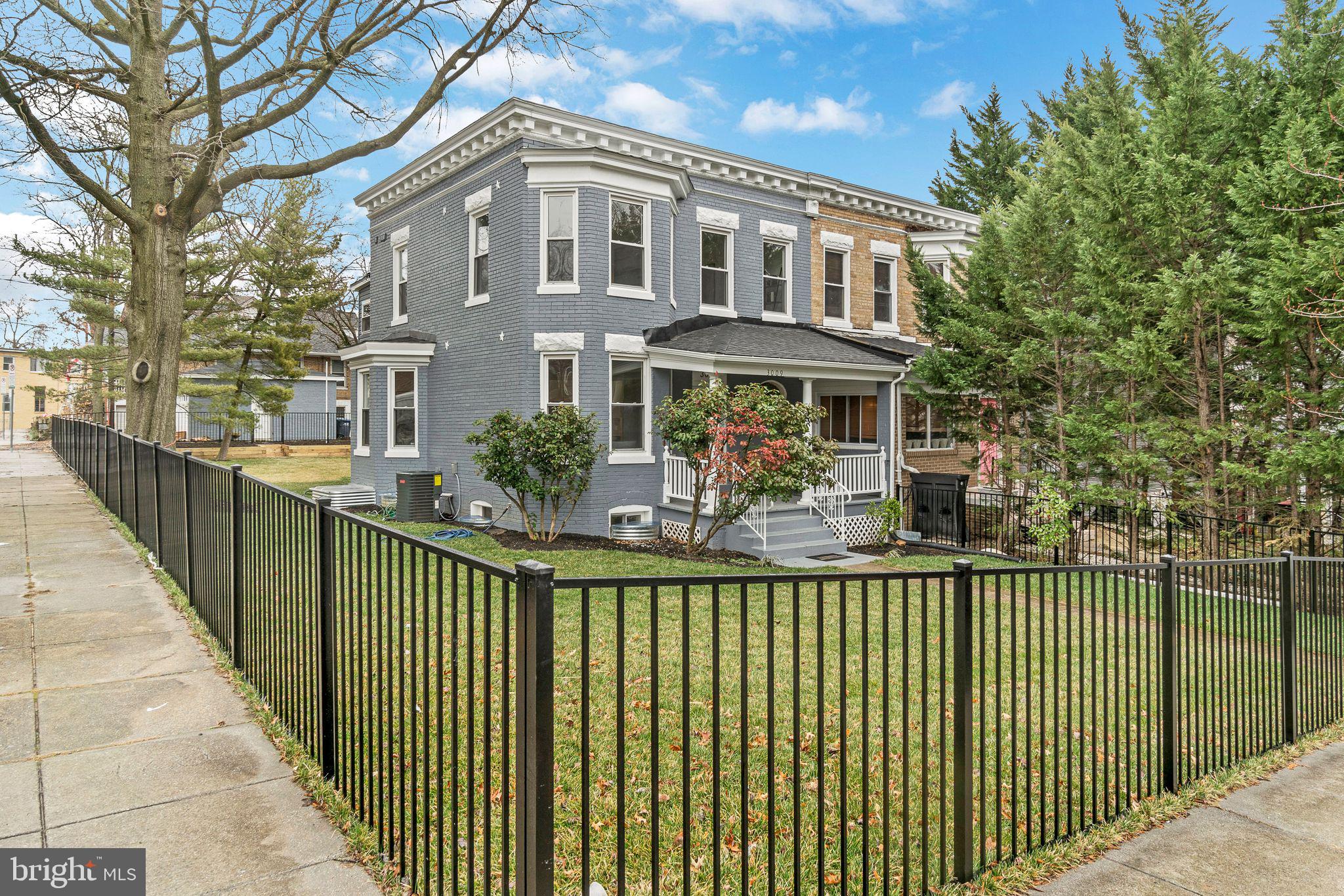 3009 20th Street Northeast Washington, DC 20018 - Photo 1 of 24 a front view of a house with a garden
