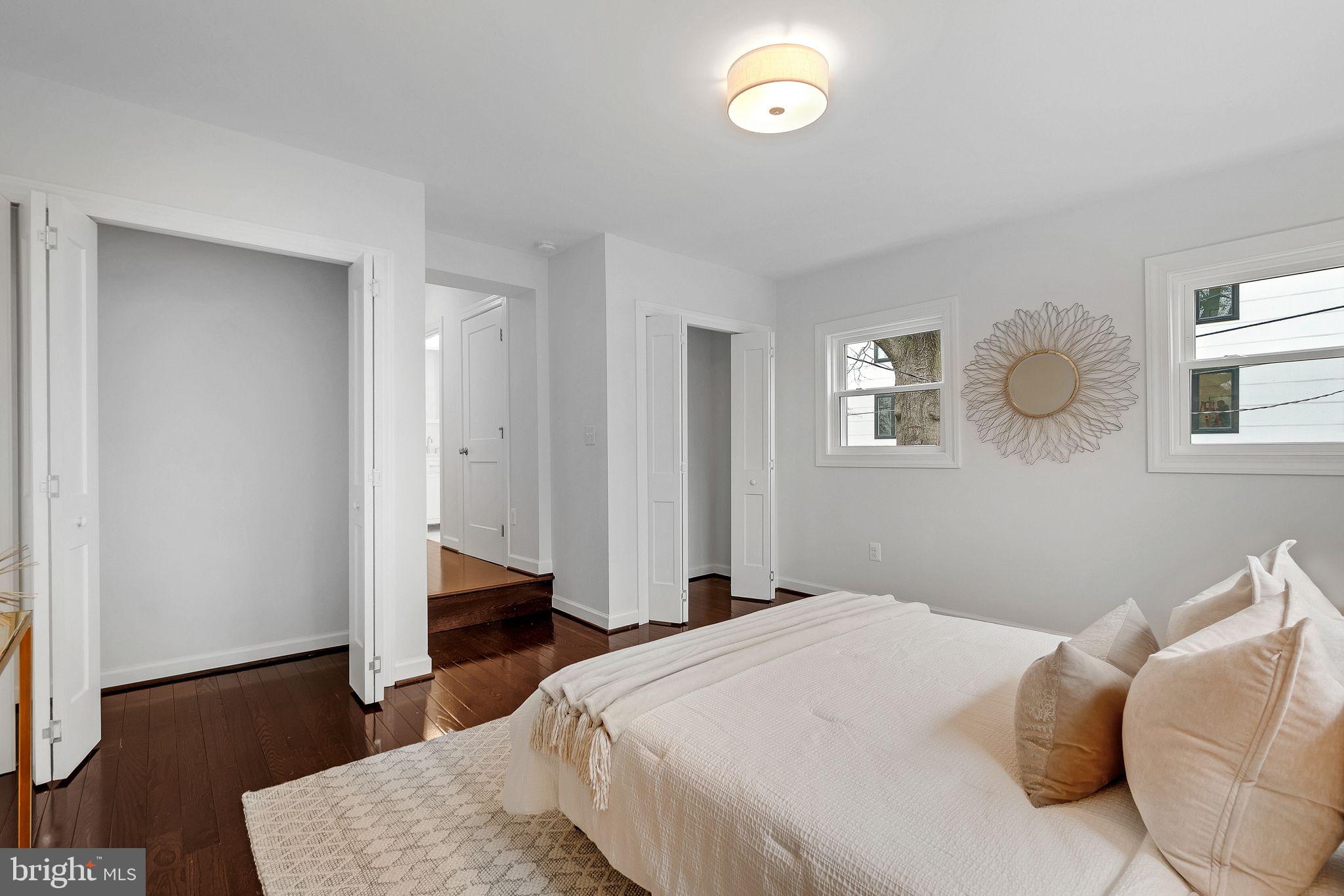 3009 20th Street Northeast Washington, DC 20018 - Photo 11 of 24 a bedroom with a bed and wooden floor