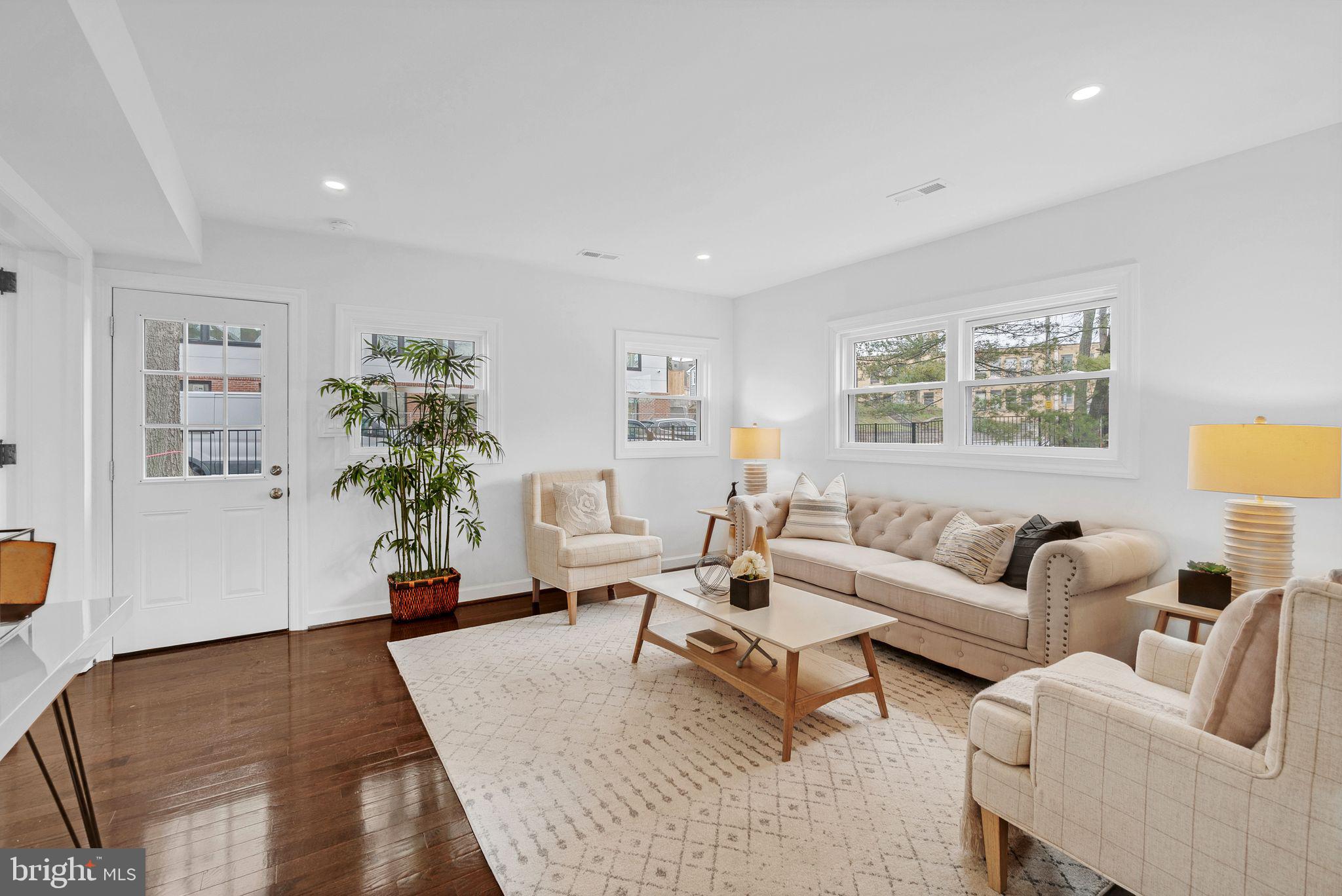 3009 20th Street Northeast Washington, DC 20018 - Photo 12 of 24 a living room with furniture and a potted plant