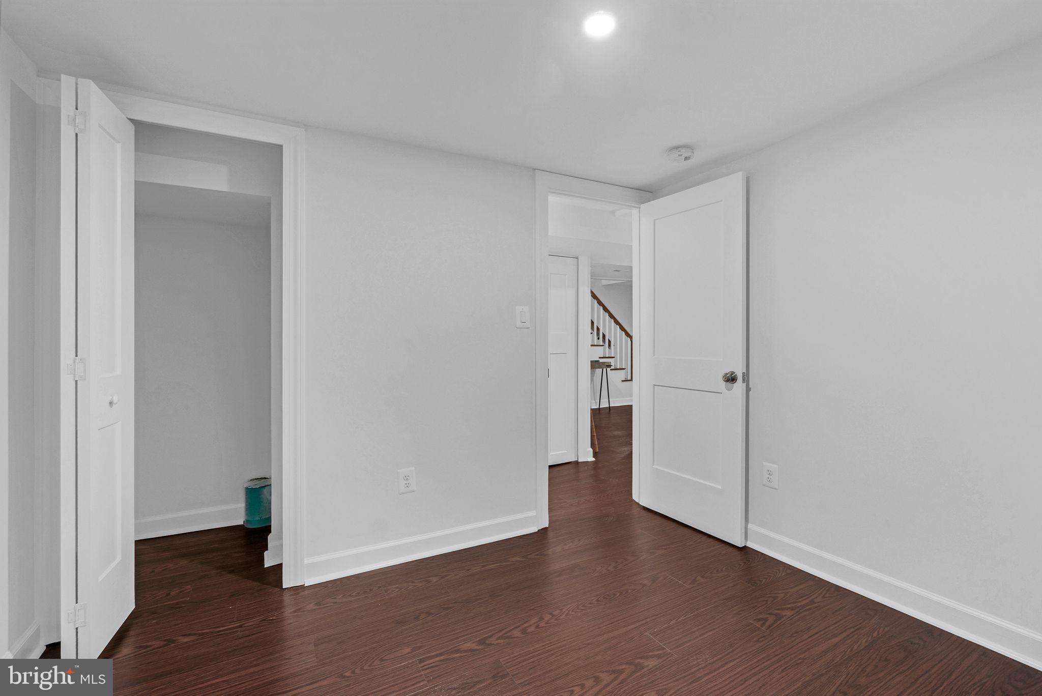 3009 20th Street Northeast Washington, DC 20018 - Photo 17 of 24 a view of an empty room with wooden floor