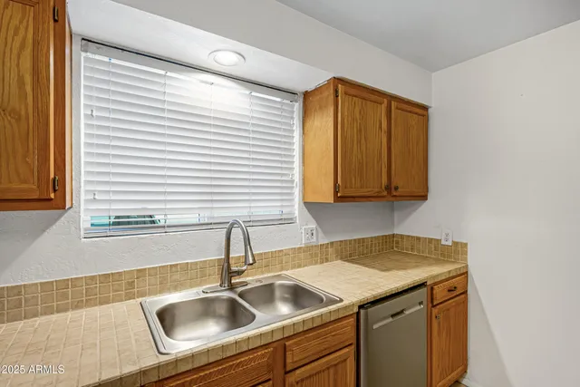 a kitchen that has a sink and a window