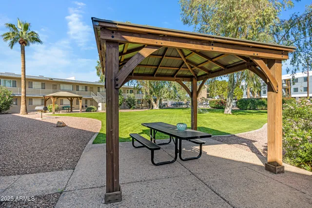 a view of yard with patio