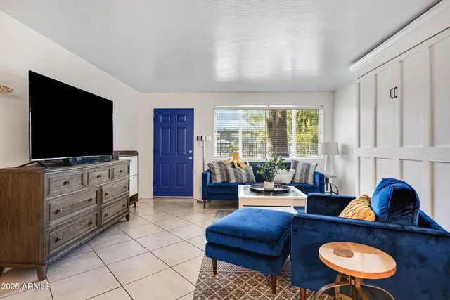a living room with furniture and a flat screen tv