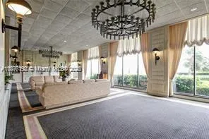 a view of a living room and chandelier