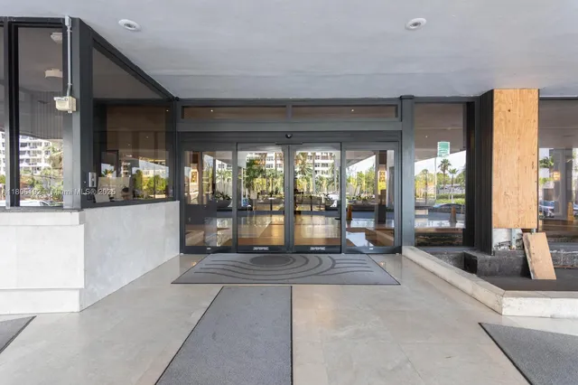 a view of a living room and a balcony