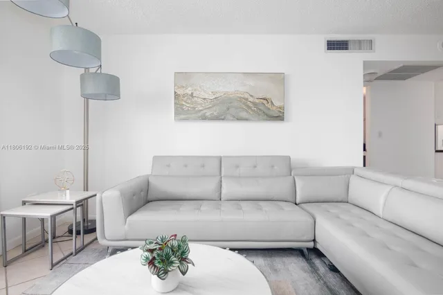 a living room with furniture and a couch