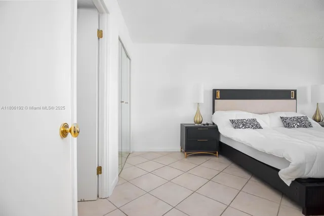 a bedroom with a bed and a table