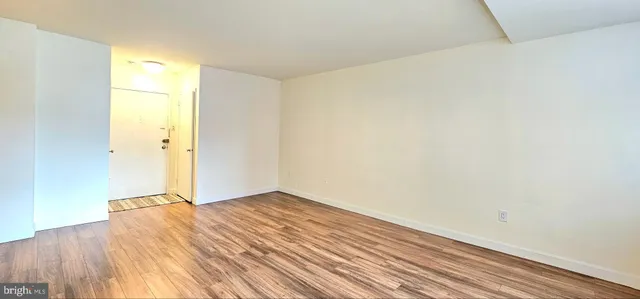 a living room with furniture large window and flat screen tv