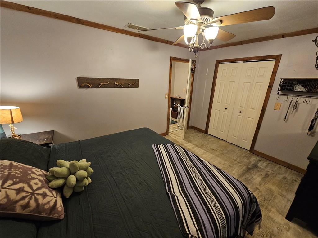 131 Chestatee Spgs Ridge Dahlonega, GA 30533 - Photo 12 of 51 a bedroom with bed and window