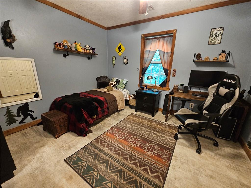 131 Chestatee Spgs Ridge Dahlonega, GA 30533 - Photo 18 of 51 a bedroom with a bed and a desk