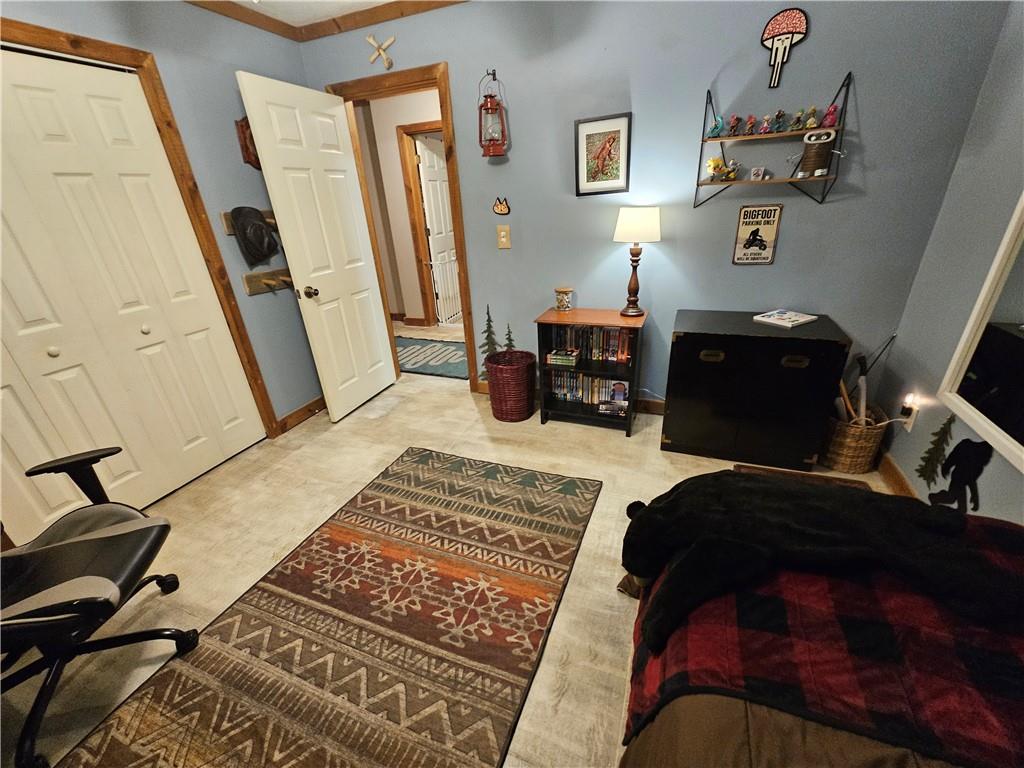 131 Chestatee Spgs Ridge Dahlonega, GA 30533 - Photo 19 of 51 a bedroom with a bed and wooden floor