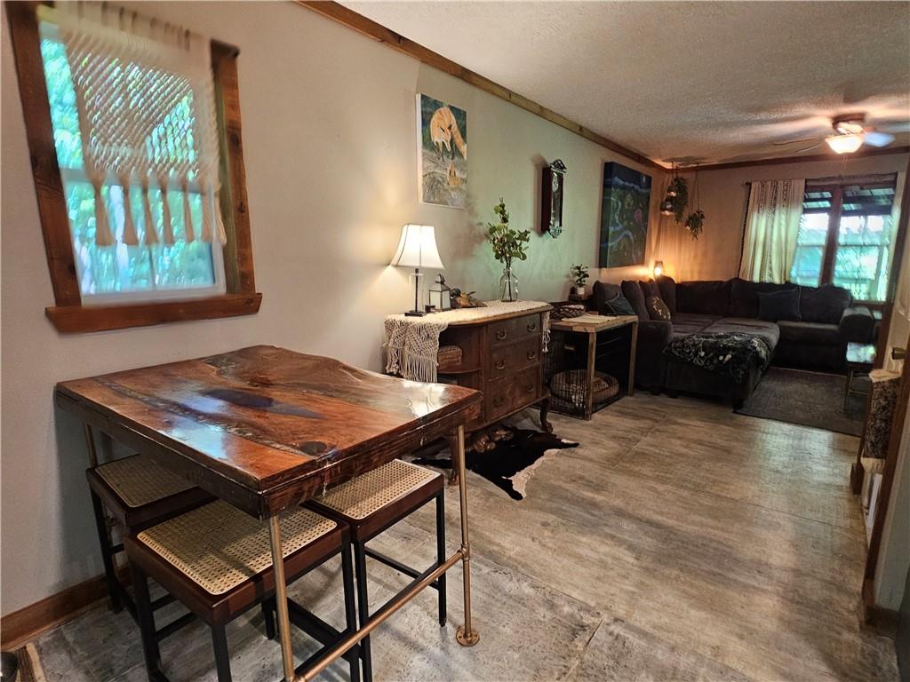 131 Chestatee Spgs Ridge Dahlonega, GA 30533 - Photo 32 of 51 a living room with furniture a window and a table