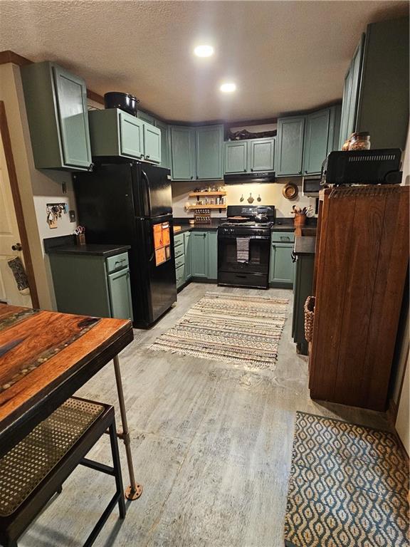 131 Chestatee Spgs Ridge Dahlonega, GA 30533 - Photo 34 of 51 a kitchen with stainless steel appliances kitchen island granite countertop a refrigerator stove top oven and cabinets
