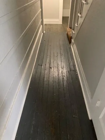 a view of balcony with wooden floor
